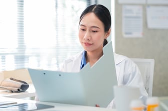 doctor holding medical file